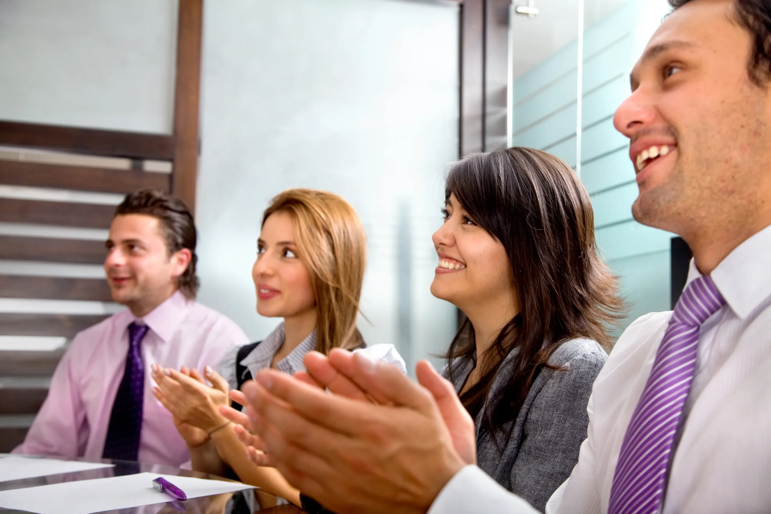 business-group-at-a-meeting-applauding-and-smiling-2026-01-09-14-41-41-utc