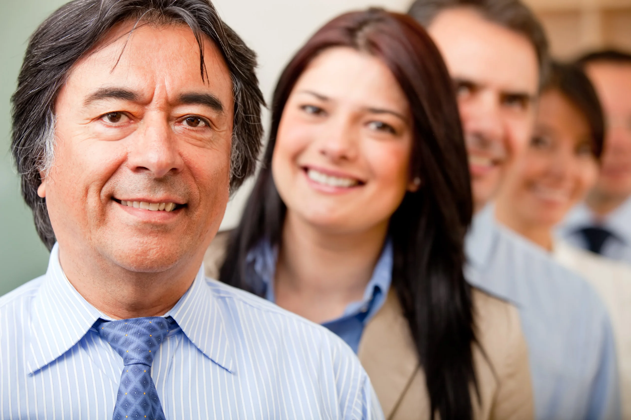 business-group-at-the-office-in-a-row-and-smiling-2026-04-14-00-51-39-utc